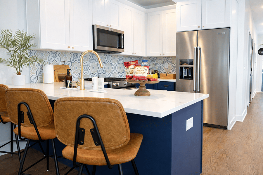 The island seats 3 with extra dining space for easy gatherings.
