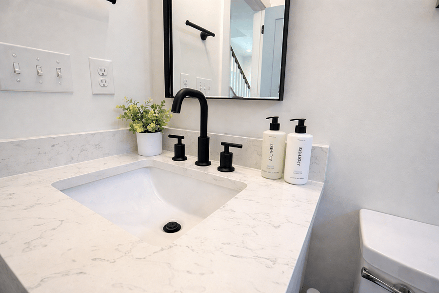 Located off The Krog Suite (downstairs queen bedroom), this spa-inspired bath offers a shower and tub, plush linens, designer interiors, and premium Apotheke products for a true boutique hotel experience.