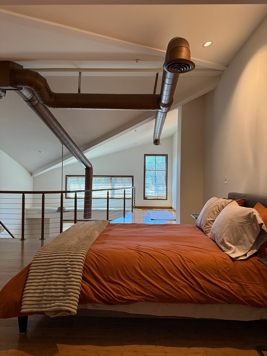 Open loft for peaceful sleep; open ducting to accentuate industrial artist loft vibe