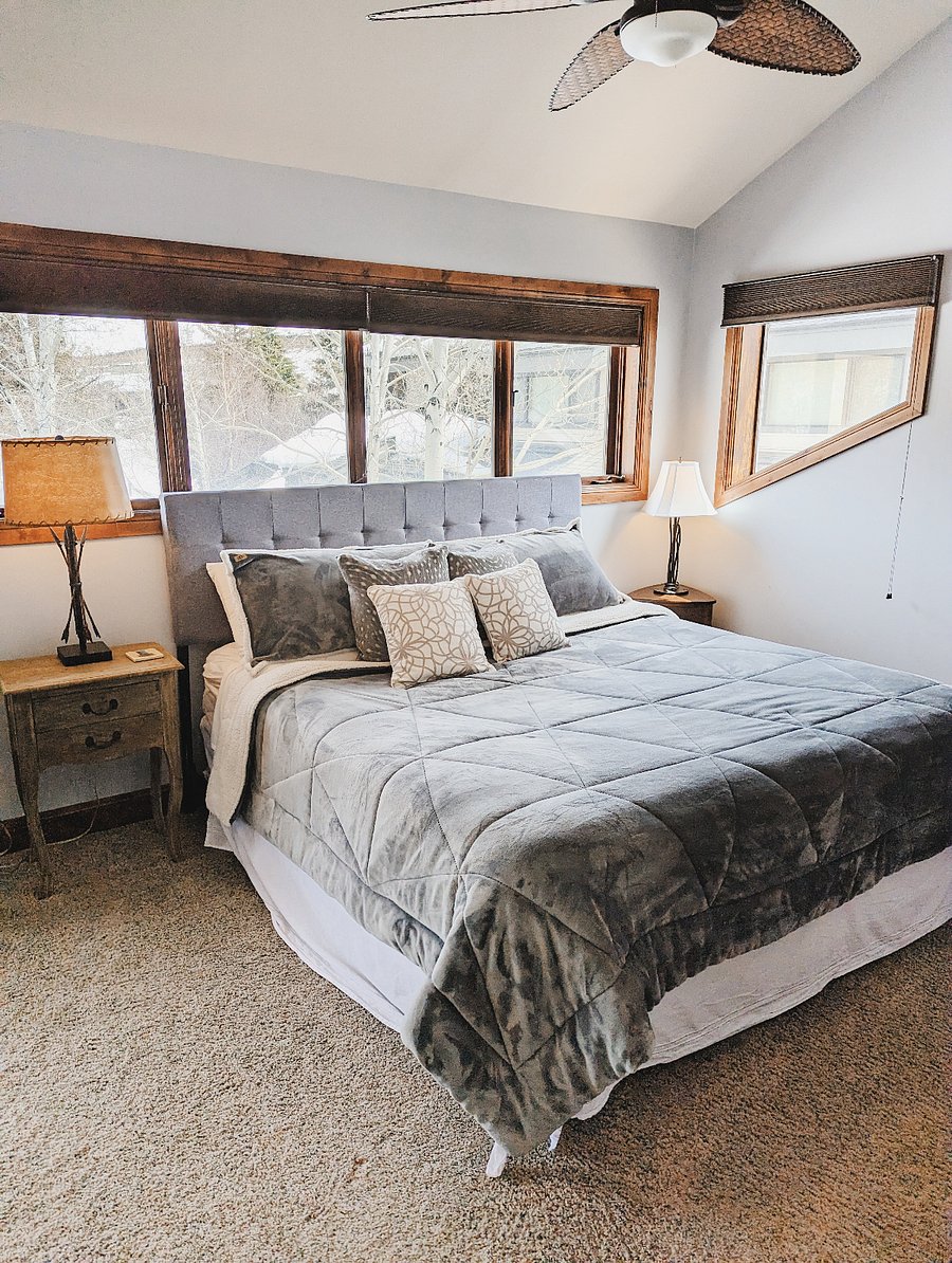 The 1st master bedroom has a comfy king size bed, plenty of closet space, a dresser, seating area and ensuite full bathroom.