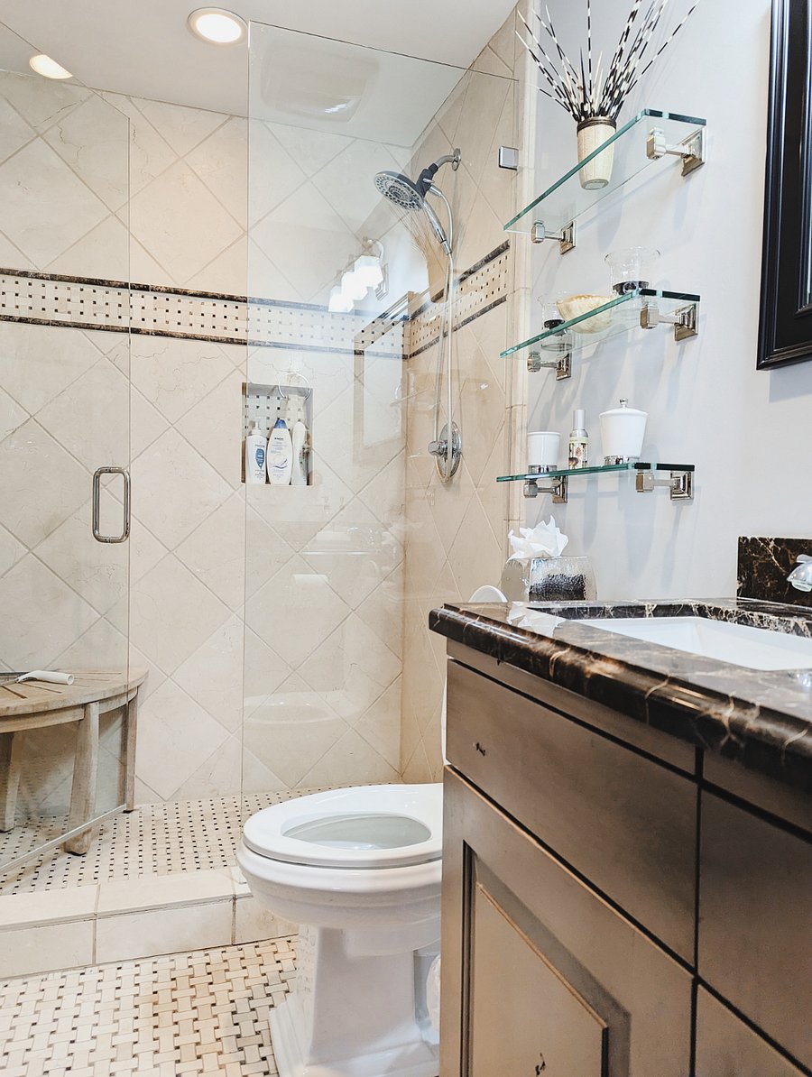 The 3rd full bathroom is adjacent to the third bedroom and is accessible from the kitchen and downstairs living space.