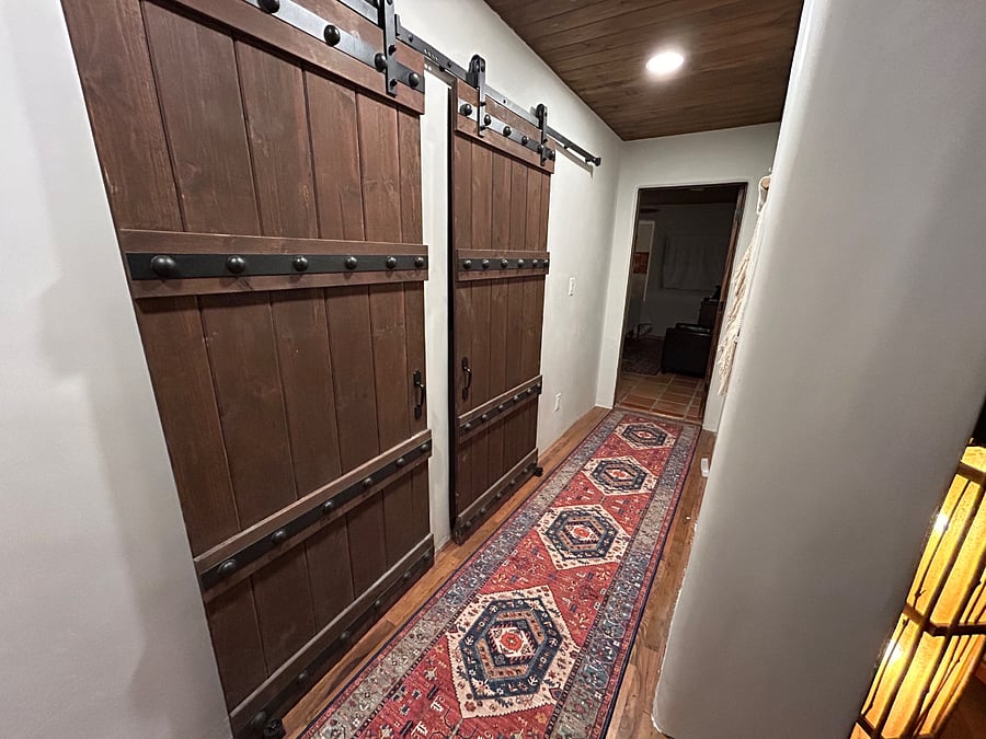 Hallway to bedrooms, baths and laundry.