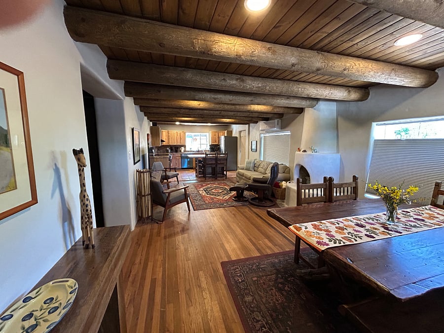 Open floor plan including dining table, living room and large eat-in kitchen with loads of natural light.