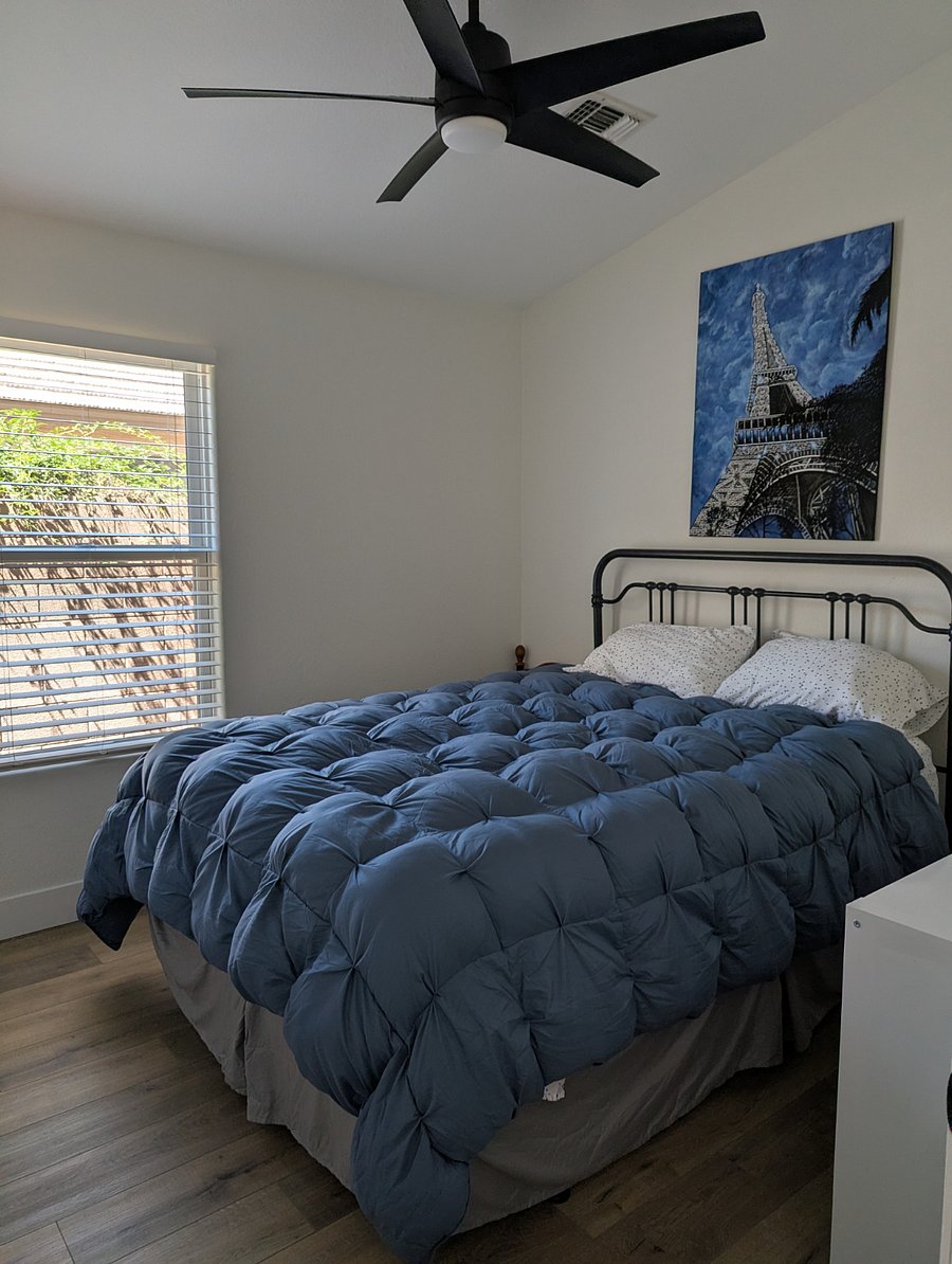 2nd bedroom with queen bed and dresser