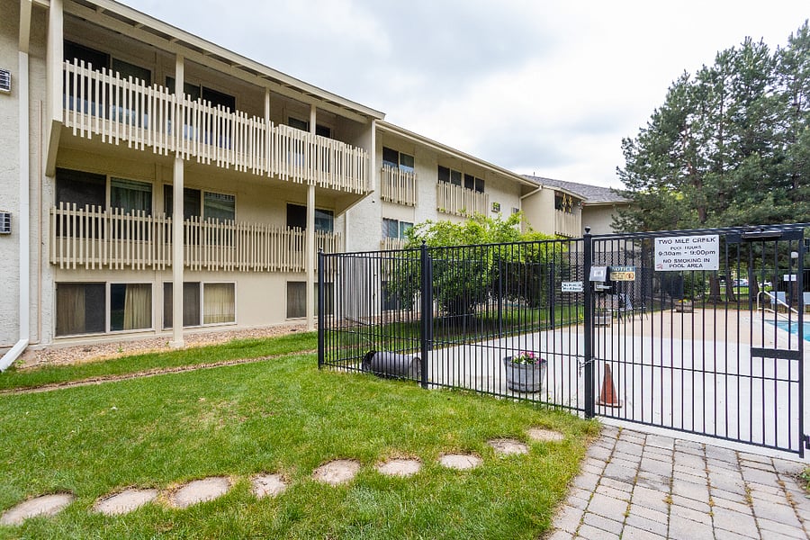 The windows for the unit face the pool but the bedrooms are behind the large bush shown here. This means you have both green views, privacy, and good sun.