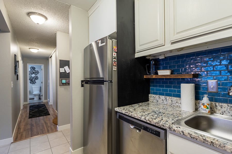 Kitchen has ceramic backsplash and lots of storage. Well equipped with all the kitchen essentials and some extra toys.