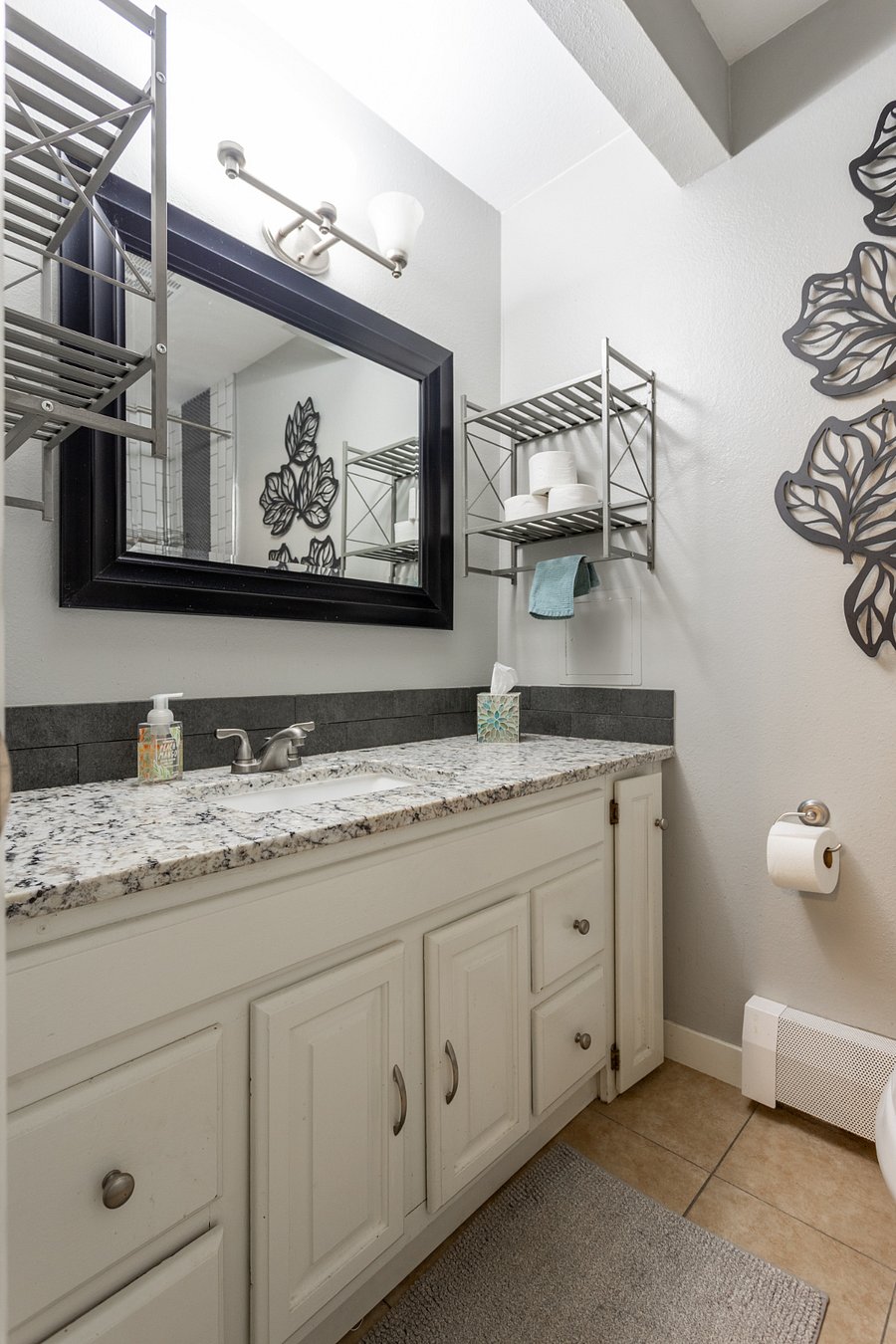 Storage in floating shelves and under counter make lots of room for shared use.