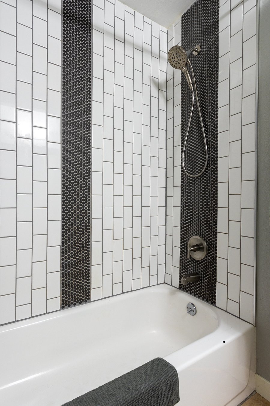 Upgraded ceramic tiled shower/tub.
