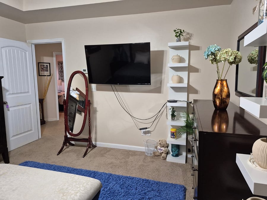 Carpeted Master Bed room - Night Stand | Dresser and Chest | Mounted Smart TV | Wall Shelving