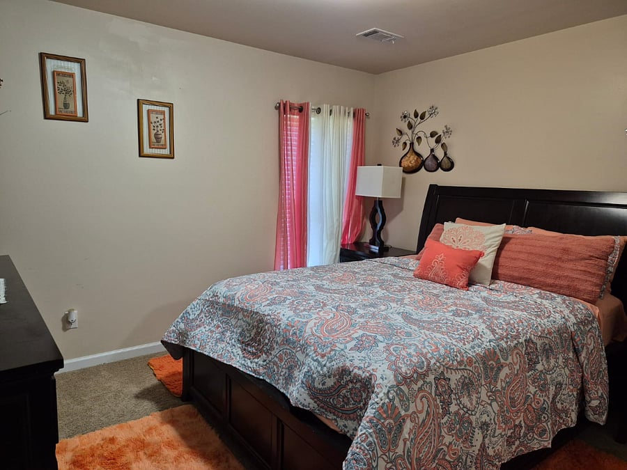 Bedroom 1 with Queen size Bed with Lower Drawers/ night stands /dresser with many storage drawers and closet