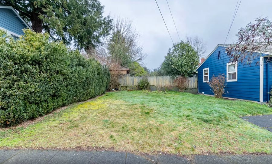 Yard is on the "west side" of the house, to access, you have to go out front door and walk around side of house. Lawn mowing service can be arranged.