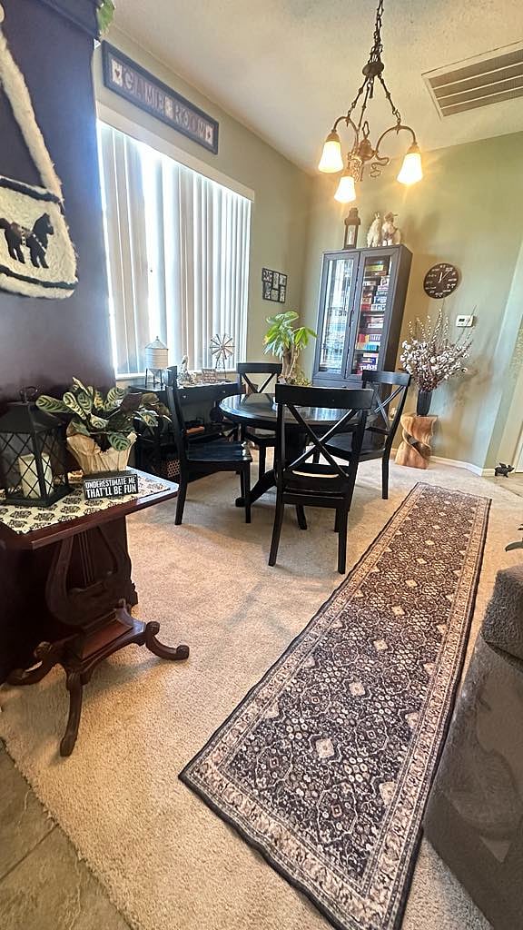 The front "dining room" is used as a game room with a cabinet full of favorite games through the ages.