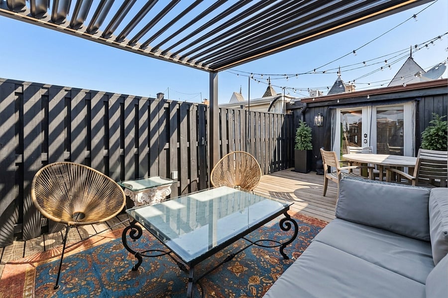 Outdoor patio with table and a led lit pergola for light night hangouts!