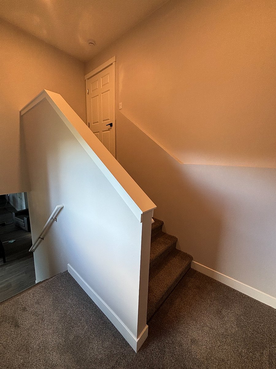 Interior stairs leading from the unit to the garage.f