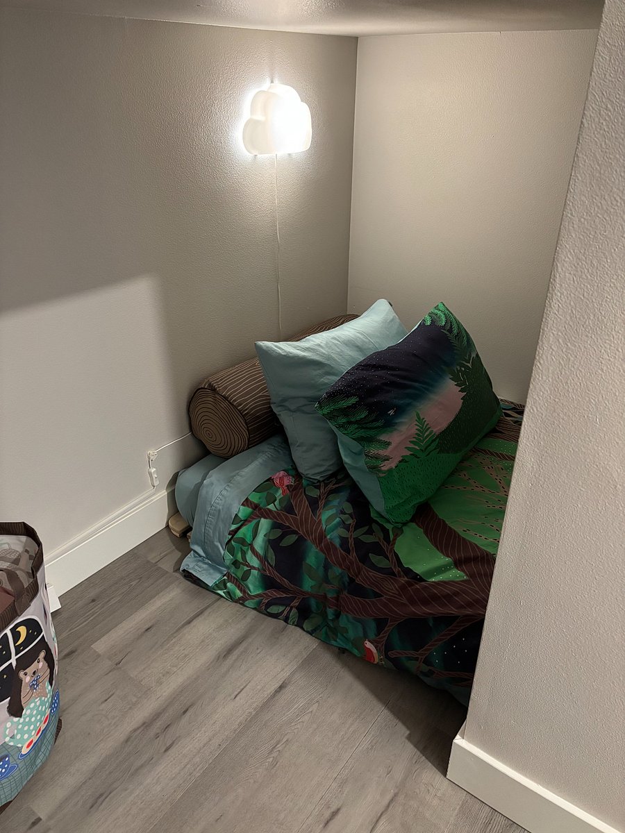 Bedroom 3 nestled under the stairs.