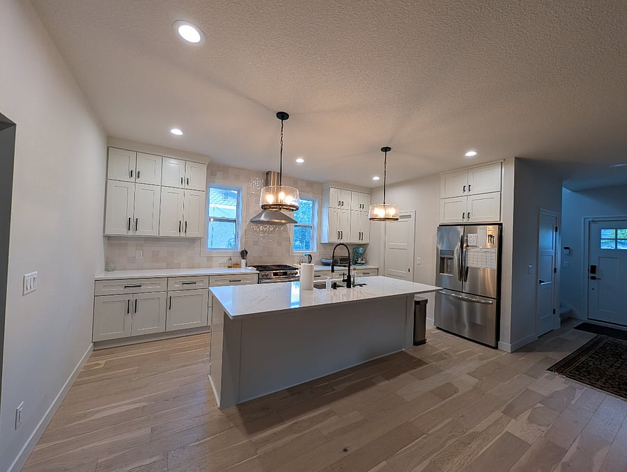 Beautiful kitchen with pantry, gas stove, and island