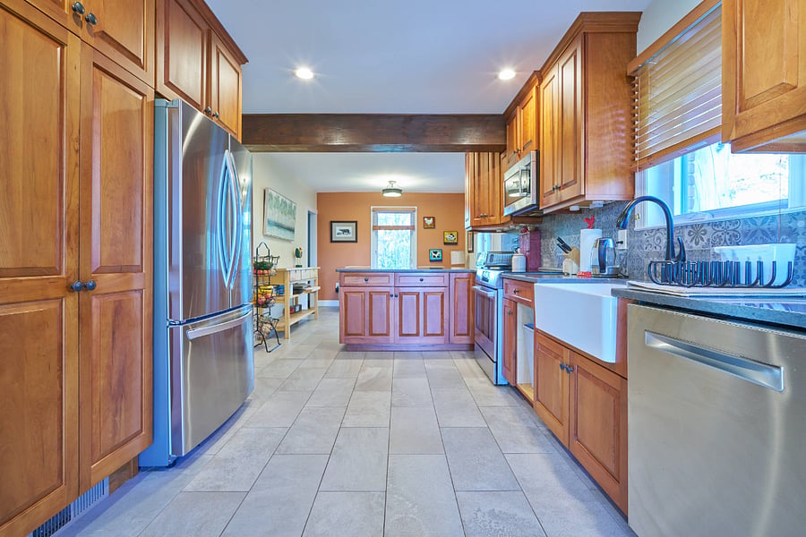 Kitchen with Bosch appliances, induction stovetop, and large porcelain apron sink