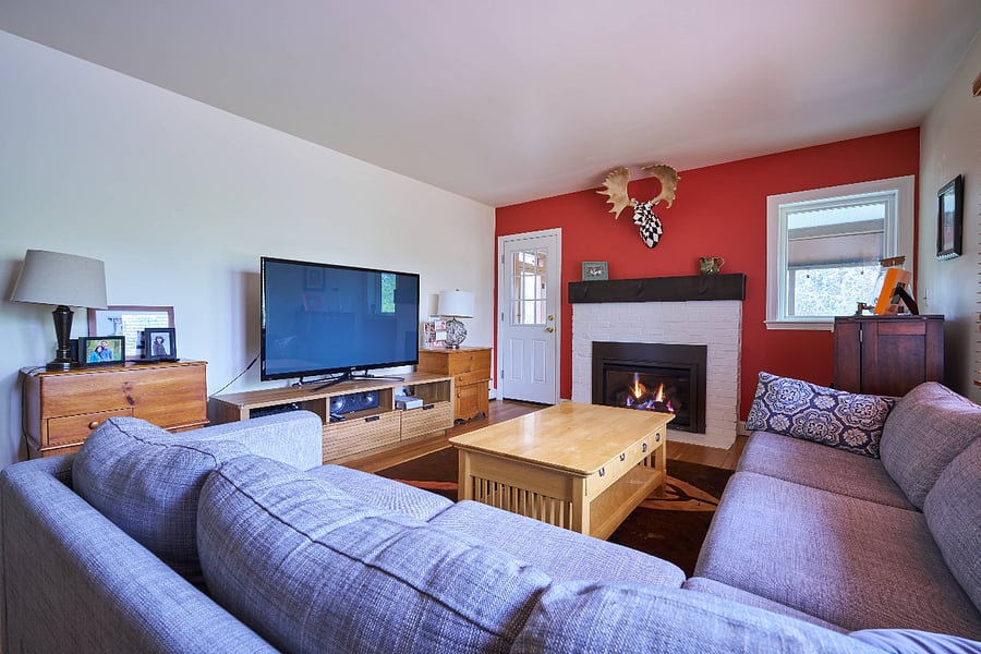 TV room that leads to screened porch
