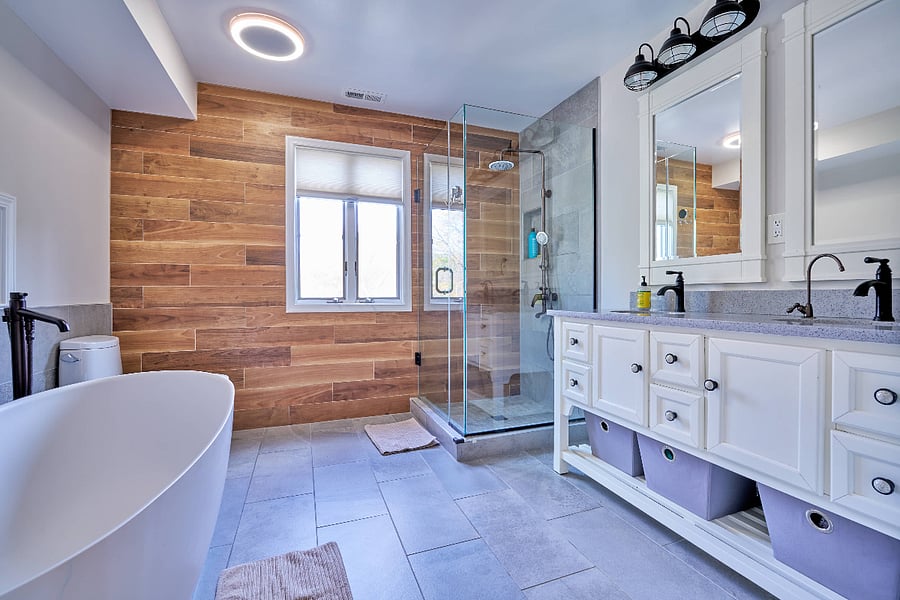 Owner's bathroom with double vanity, separate shower, and soaking bathtub