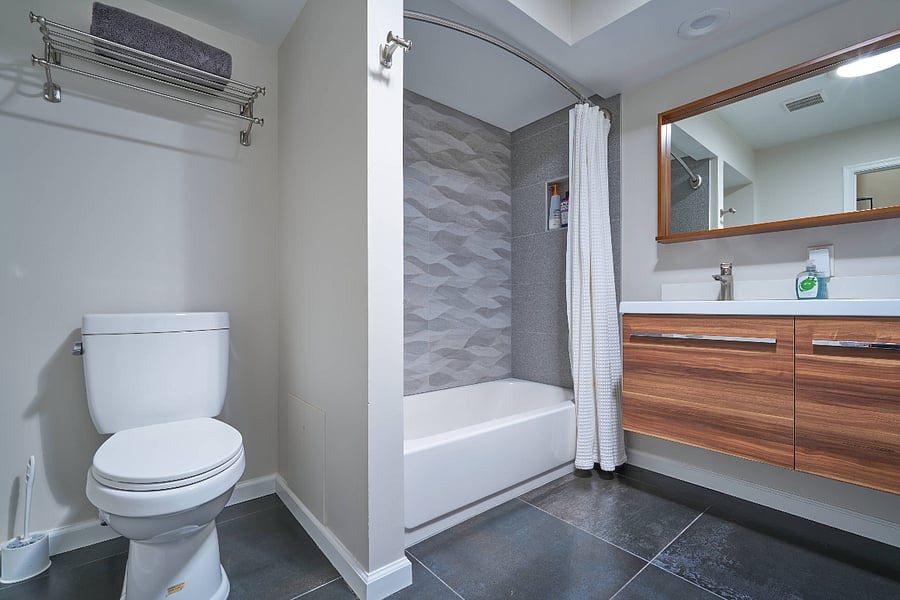 hallway bathroom on upper level with double vanity