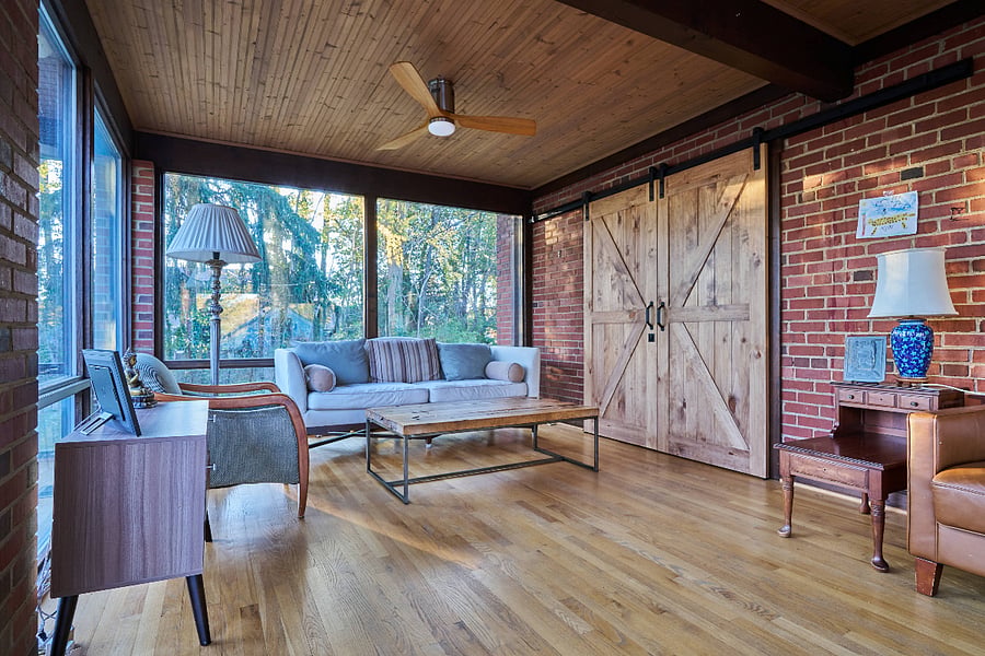 barn door that closes off the flex space, which could be used as a main level bedroom or private office