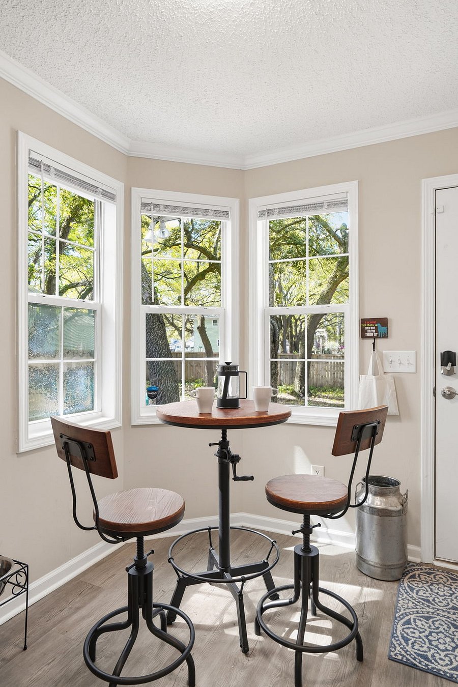 Enjoy your morning coffee while gazing at the live oaks in the backyard.