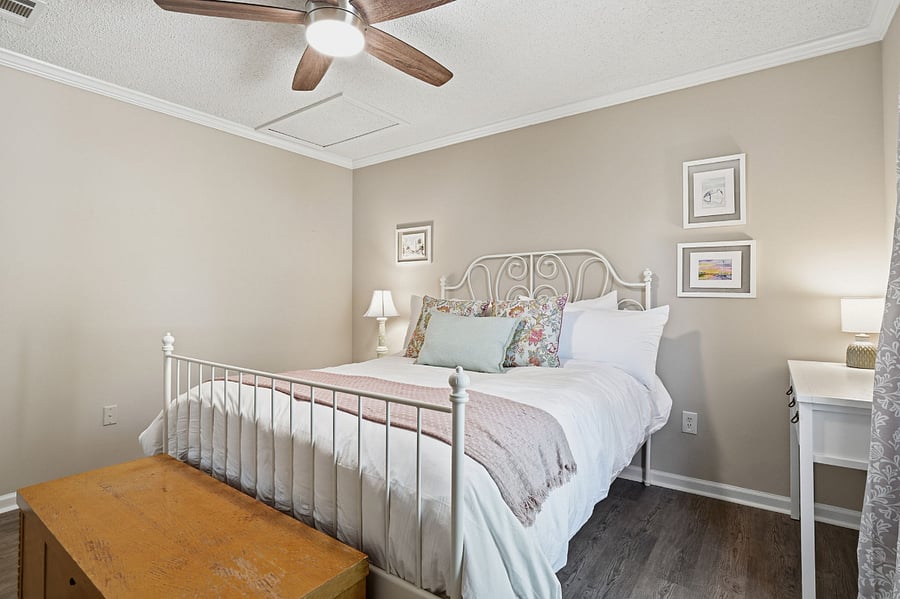 2nd Bedroom with queen bed, closet, cedar chest for additional storage, and desk.