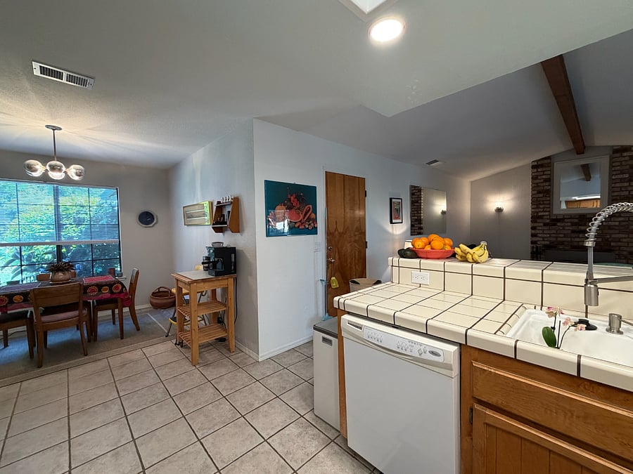 The kitchen connects to the dining nook and main living room.