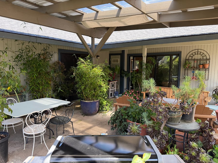 The sliding glass door on the left leads to the master bedroom. The one on the right leads to the main living room.