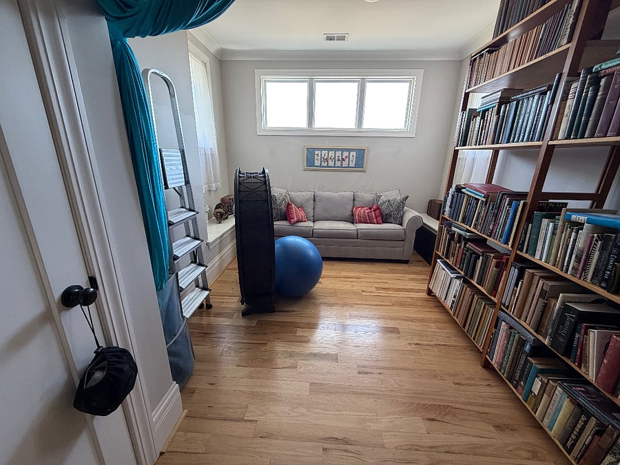 Upstairs, top of stairs extra space, for reading, working out, and for the cat to run on her wheel