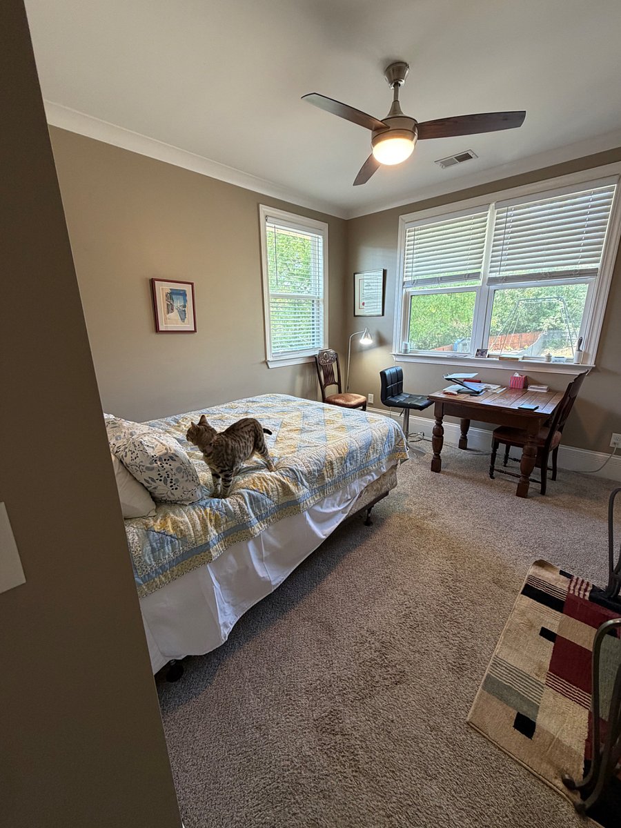 Upstairs bedroom with hall bath looking in from the door