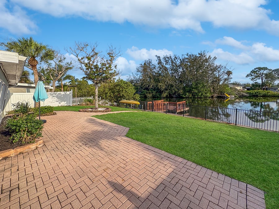 Direct residential canal access featuring a private dock. The perfect spot for launching a kayak, dolphin spotting, or watching local manatees swim by.