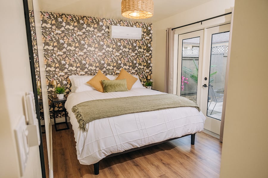 Primary bedroom with Cal King Dreamcloud bed and high quality cotton sheets