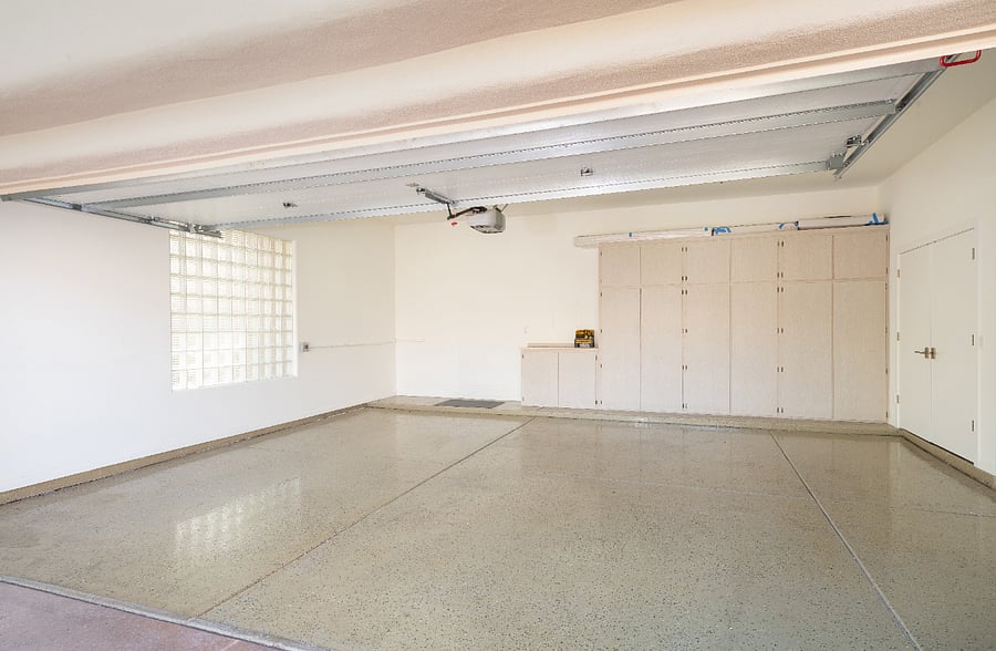 Attached two-car garage with additional storage space.