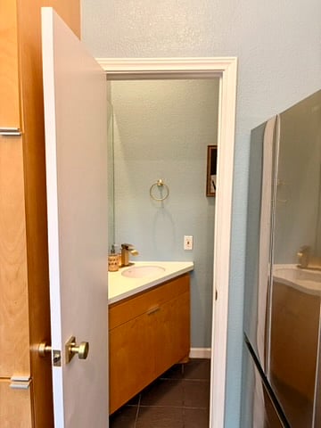 An updated half-bath is conveniently located off the kitchen.