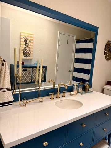 The bathroom has an updated faucet and vanity.