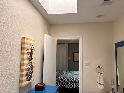 The bathroom looking into the primary bedroom.