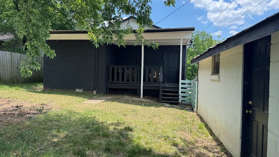 Backyard looking at house and detached garage