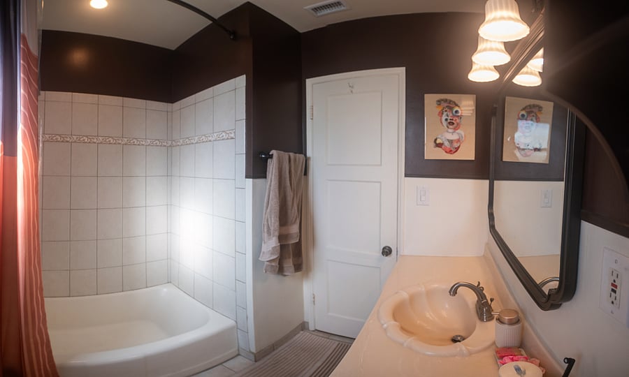 Original shell sink from the 1950s and original tile, but everything else is updated and new! The curtain rod is curved to allow for more shower space.
