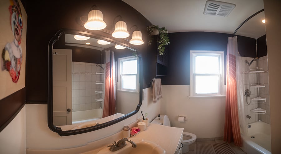 Original shell sink from the 1950s and original tile, but everything else is updated and new! The curtain rod is curved to allow for more shower space.