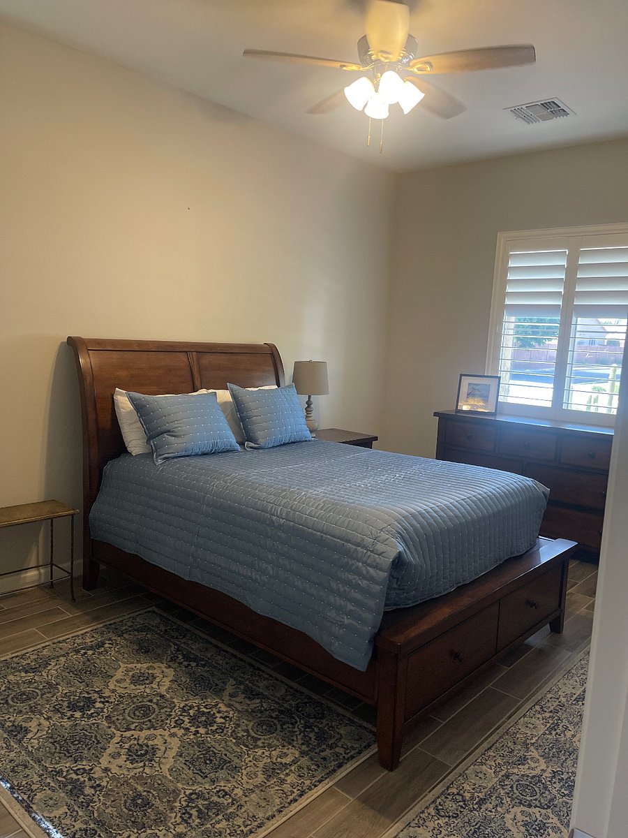 Bedroom #1 w/Queen Bed, Dresser, Nightstand, Closets, and Two Chairs.