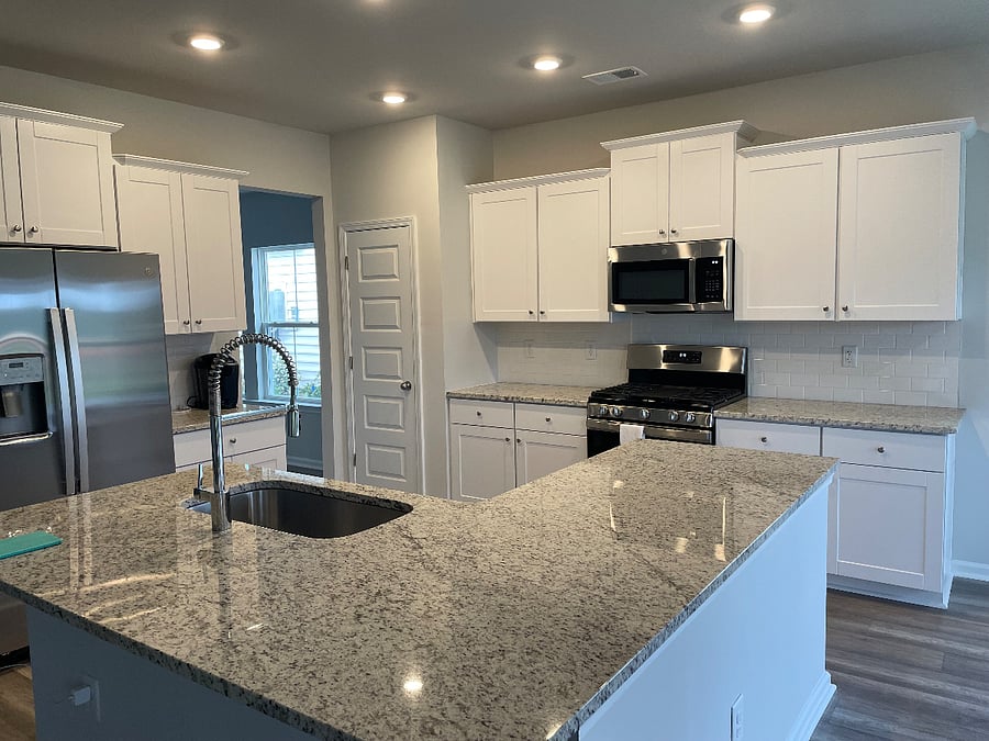 Beautiful kitchen with all pots pans, utensils, and small appliances that are needed.