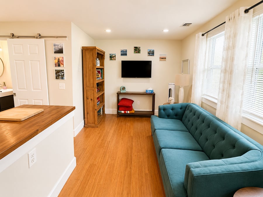 Living room with 40" TV and bookshelves.