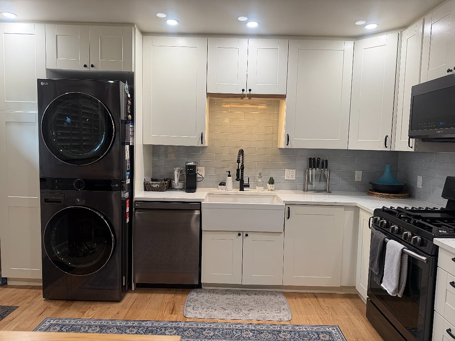 Kitchen with built-in wash tower, coffee station and farmhouse sink