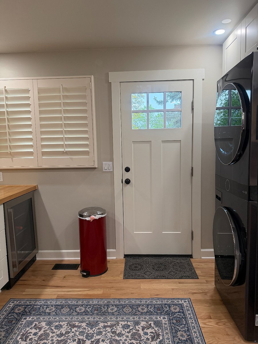 Back door to back yard. Beverage cooler in peninsula.