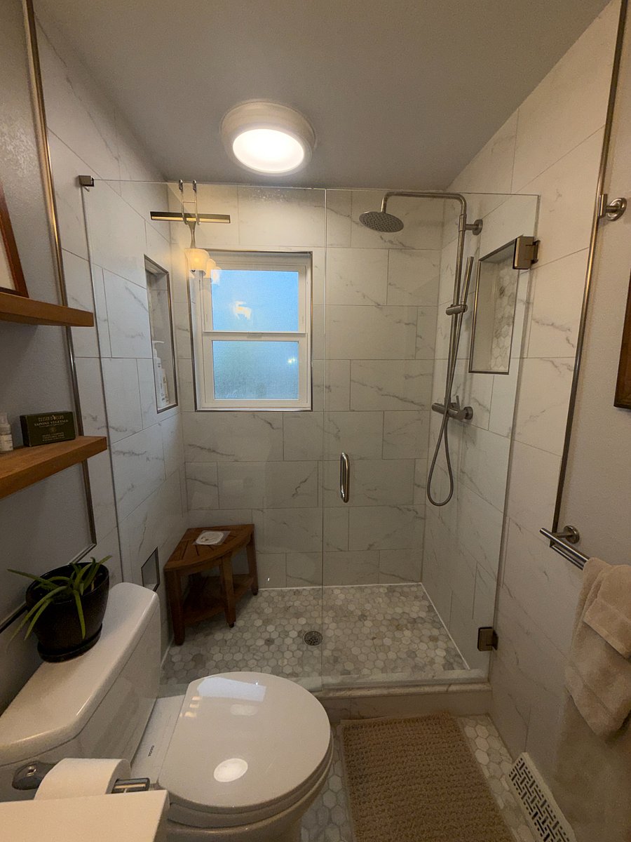 En-suite primary bathroom (rain shower)