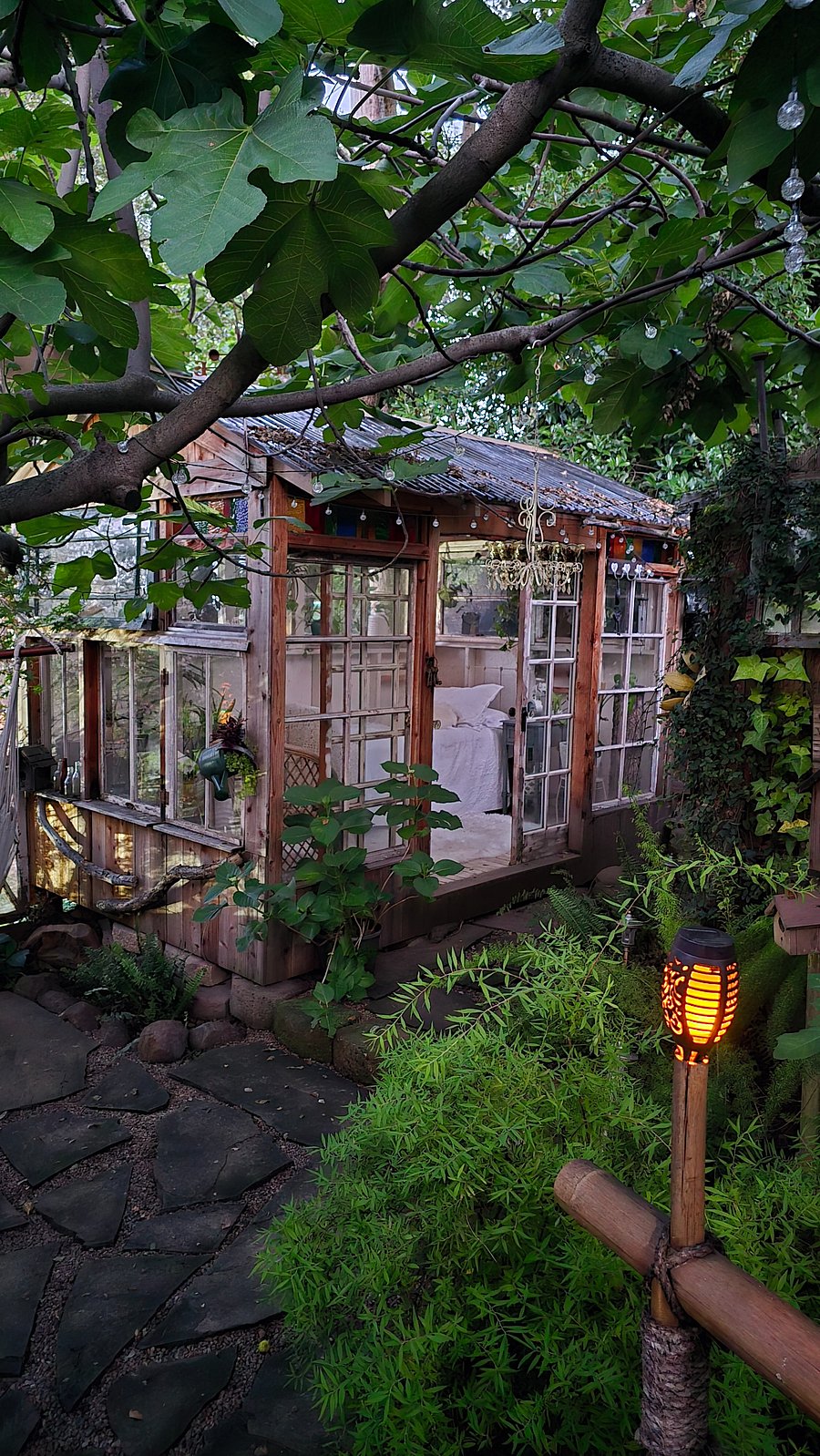 'The Love Shack' made from upcycled windows from homes in Sacramento's Fabulous 40's. This is tucked away in the backyard and a perfect place to enjoy the beauty and take a nap. Morning coffee out here is awesome!