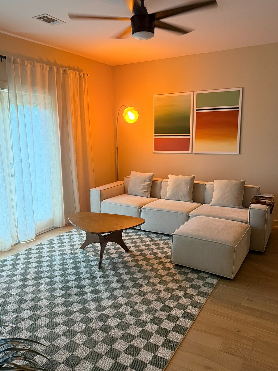 Spacious and comfortable living room with ambient lighting and a modular couch.