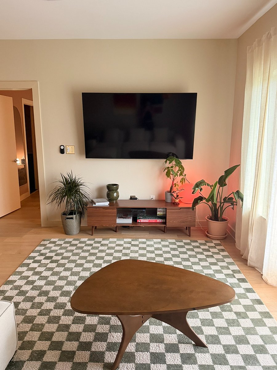85" flat screen TV complete with entertainment center. Fully stocked with game night favorites and puzzles with great natural lighting for thriving plants. 