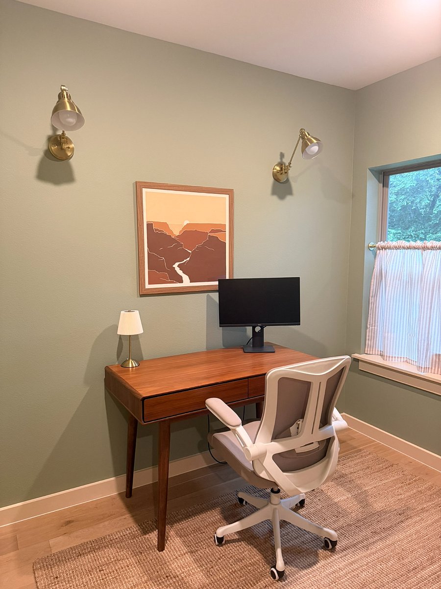 Office complete with HDMI cords, Monitor, and ergonomic desk chair. 